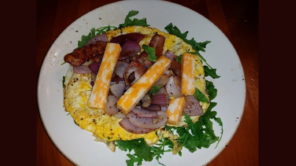 Breakfast Winner Eggs Arugula Colby Cheese and Bacon